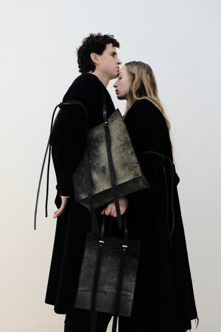 Two models carry the vibrant tote - small in their hand and the vibrant tote - large over their shoulder